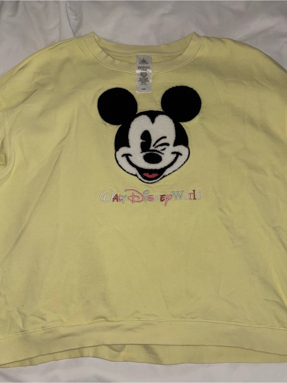 Disney Yellow Crewneck Sweatshirt with Winking Mickey Graphic